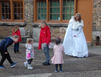 Children playing with the snow queen