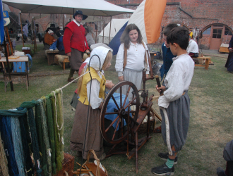 17th Century spinning wheel in action