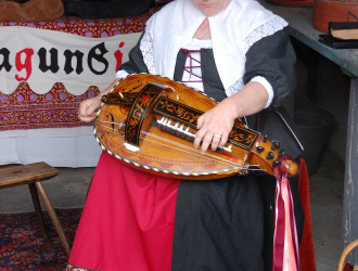 17th Century woman playing a stringed instrument