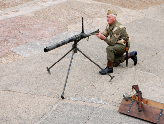 Home Guardsman aiming improvised anti-tank weapon