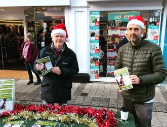 Landguard Trust Chairman Tim with Landguard Partnership Project Officer Paul handing out leaflets at Christmas market 2019