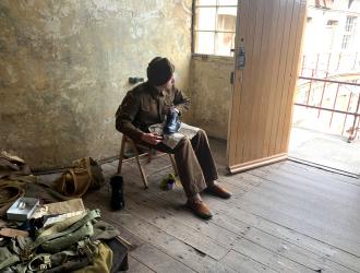 Soldier polishing boots