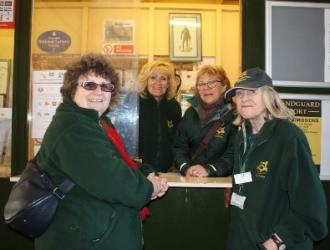 Lady volunteers at ticket office